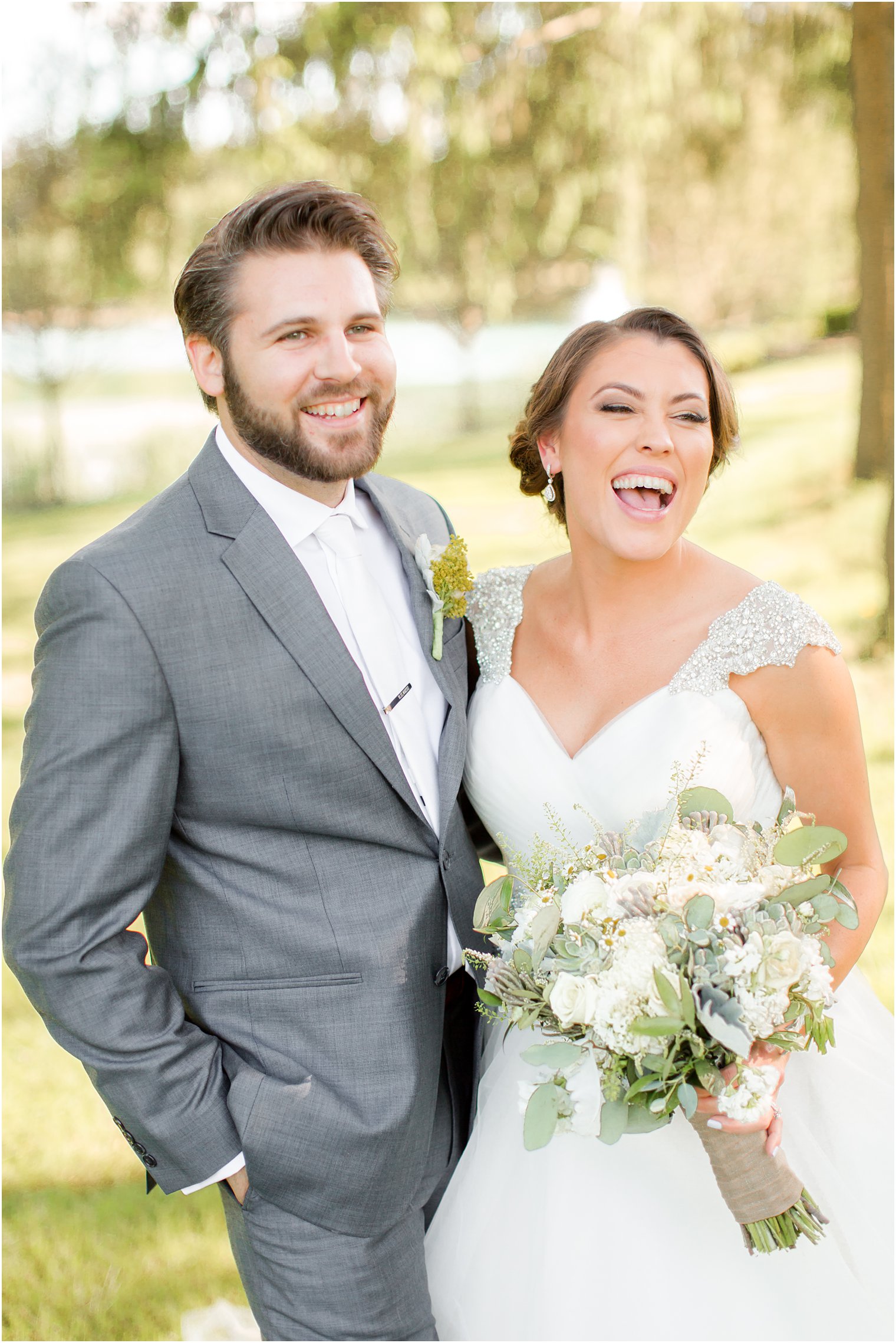 bride and groom laughing during candid photo