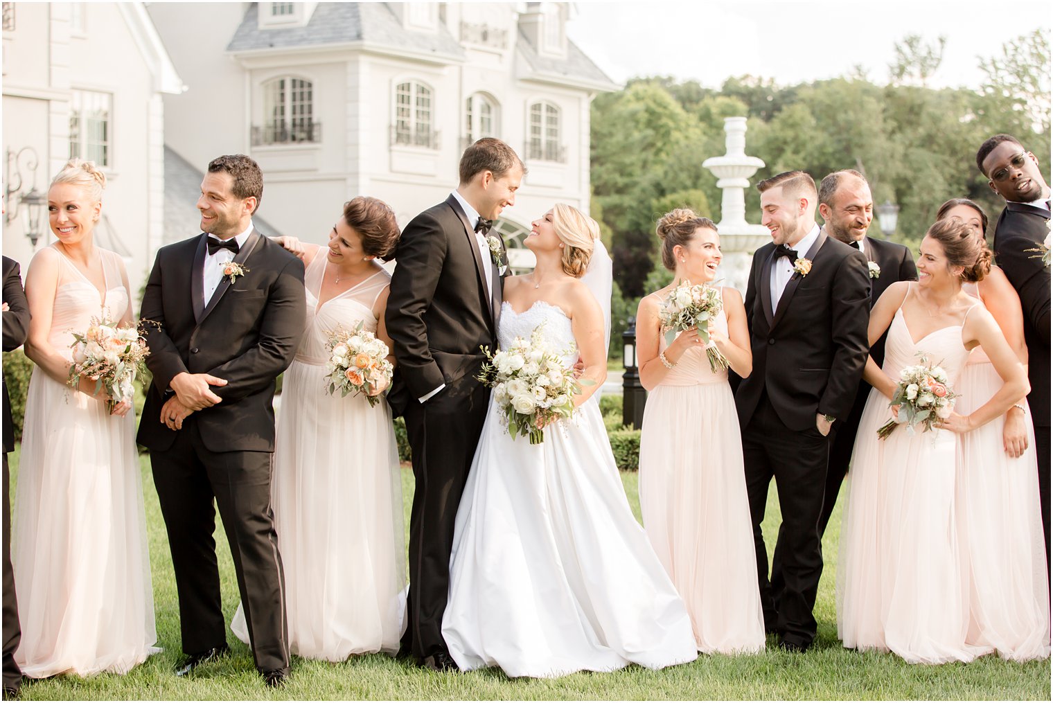candid photo of bridal party at park chateau in east brunswick, NJ