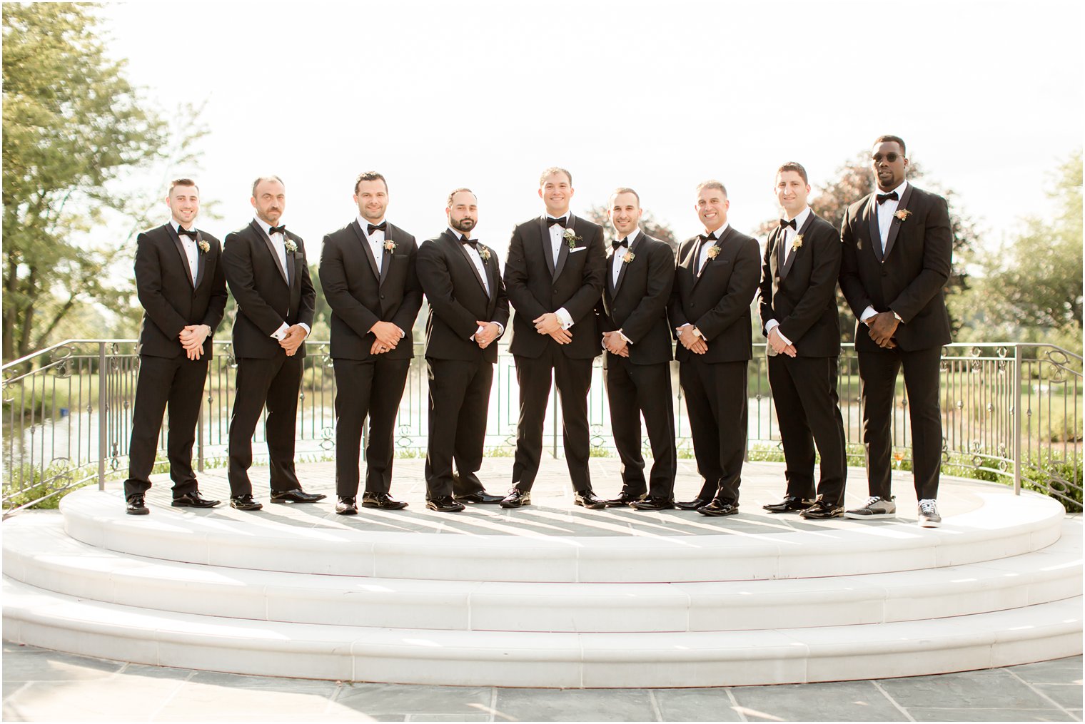 Groomsmen wearing black tuxedos