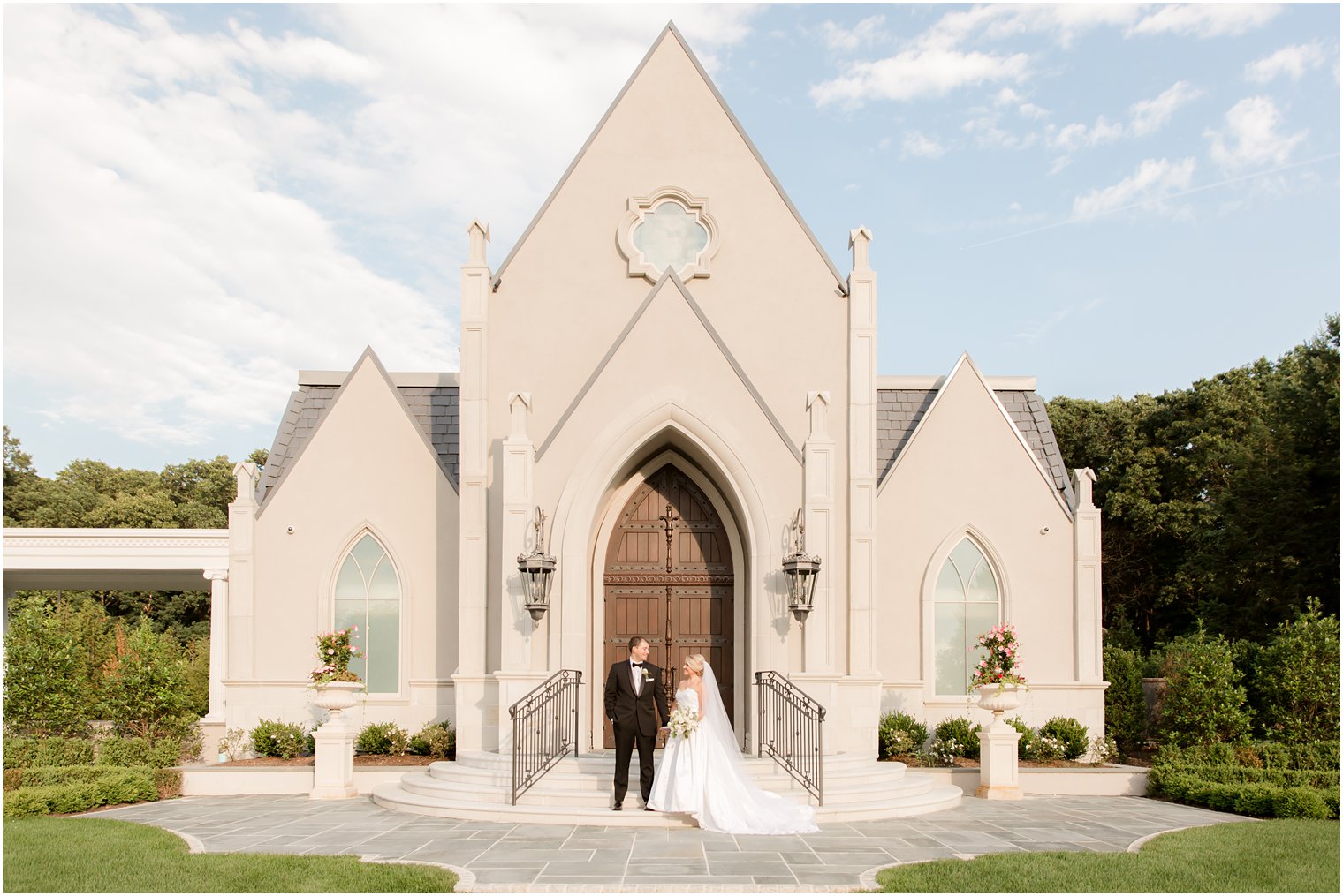 Couple posing for a photo in front of Park Chateau Chapel