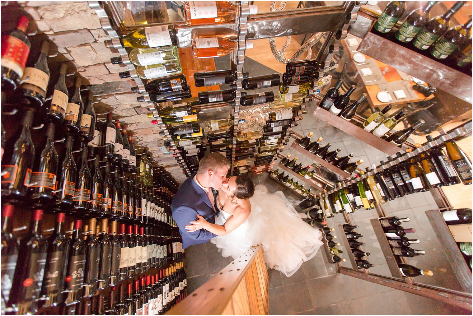 wedding photo of bride and groom in wine cellar at Stone House at Stirling Ridge