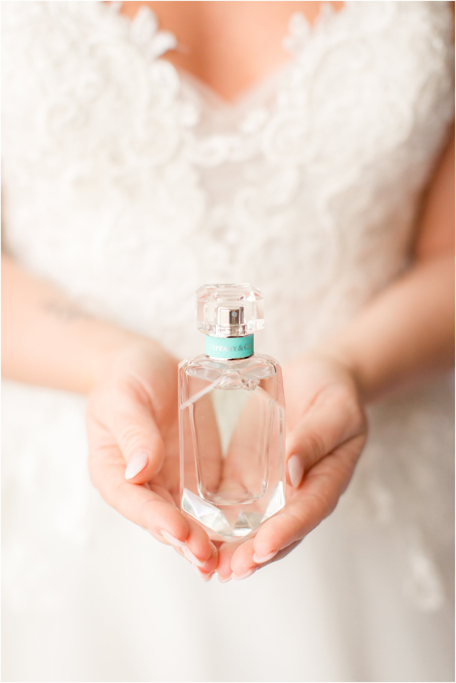 bride holding Tiffany's perfume
