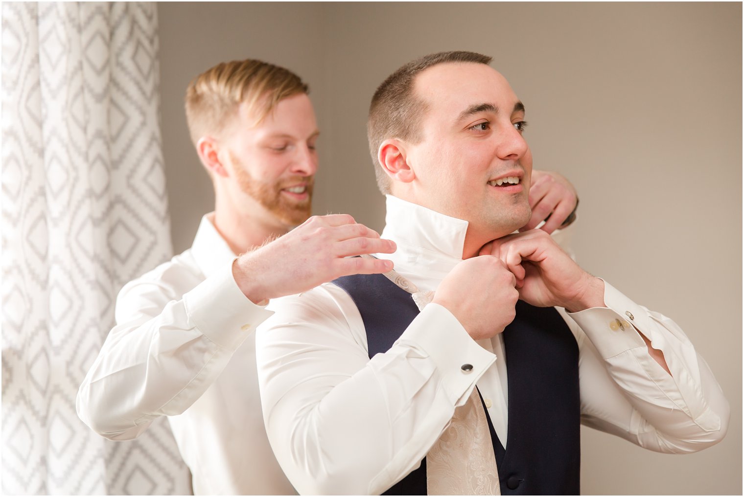 groom getting ready with best man