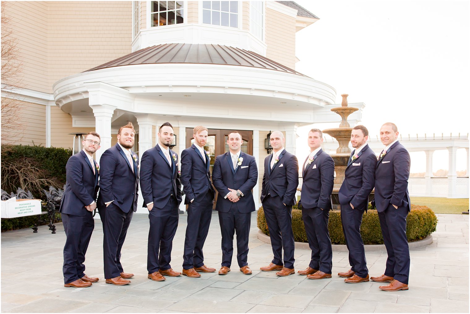 classic groomsman photo in front of Clarks Landing Yacht Club