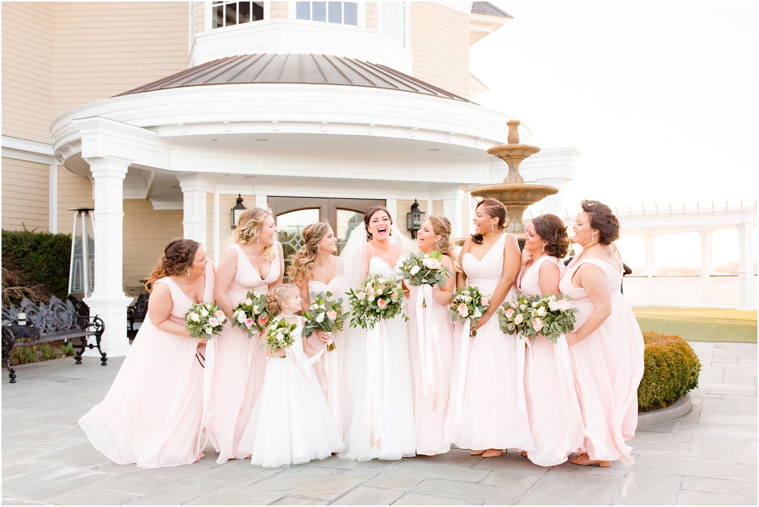 bridesmaids having fun on their wedding day