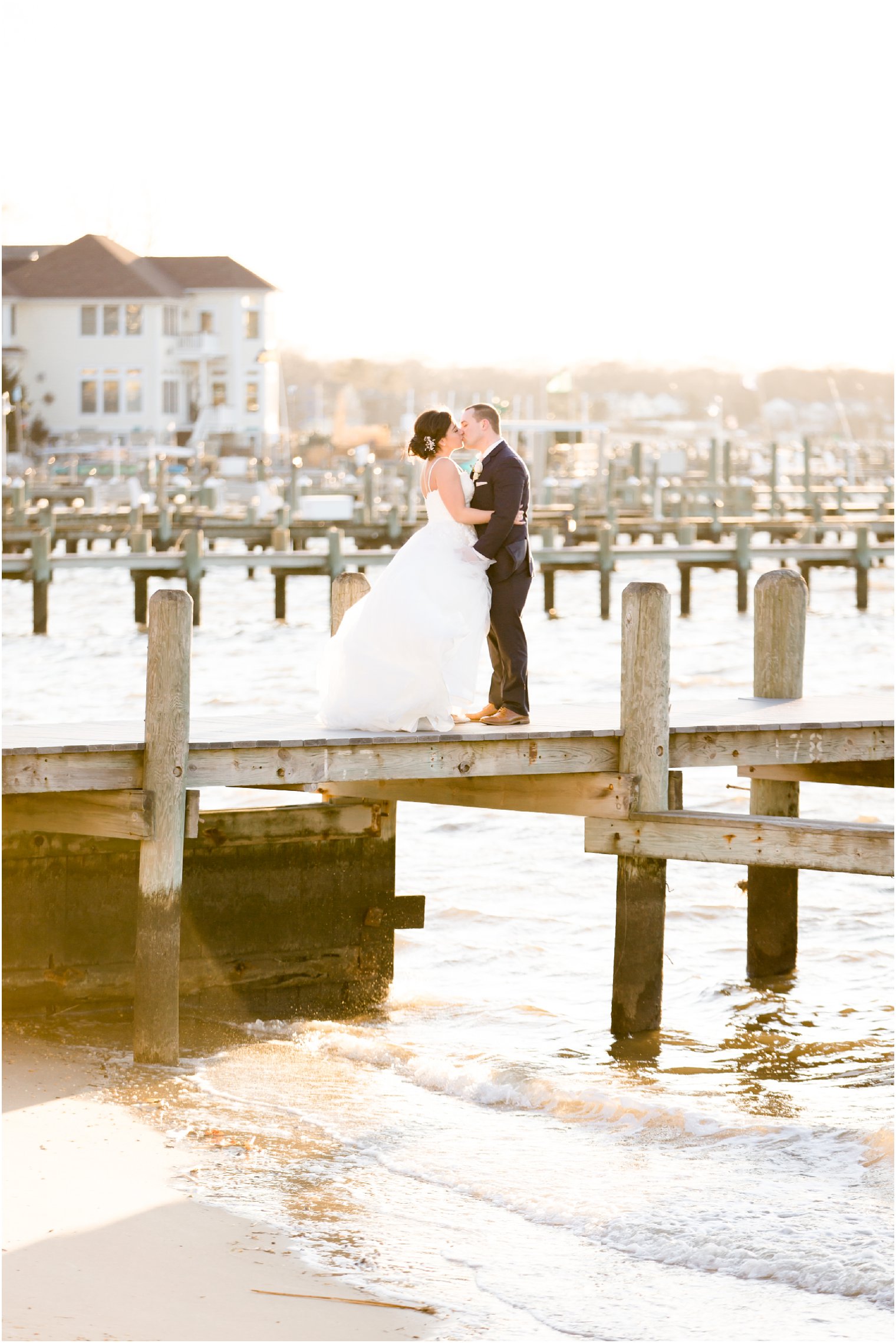 romantic sunset photo of bride and groom on docks at Clarks Landing