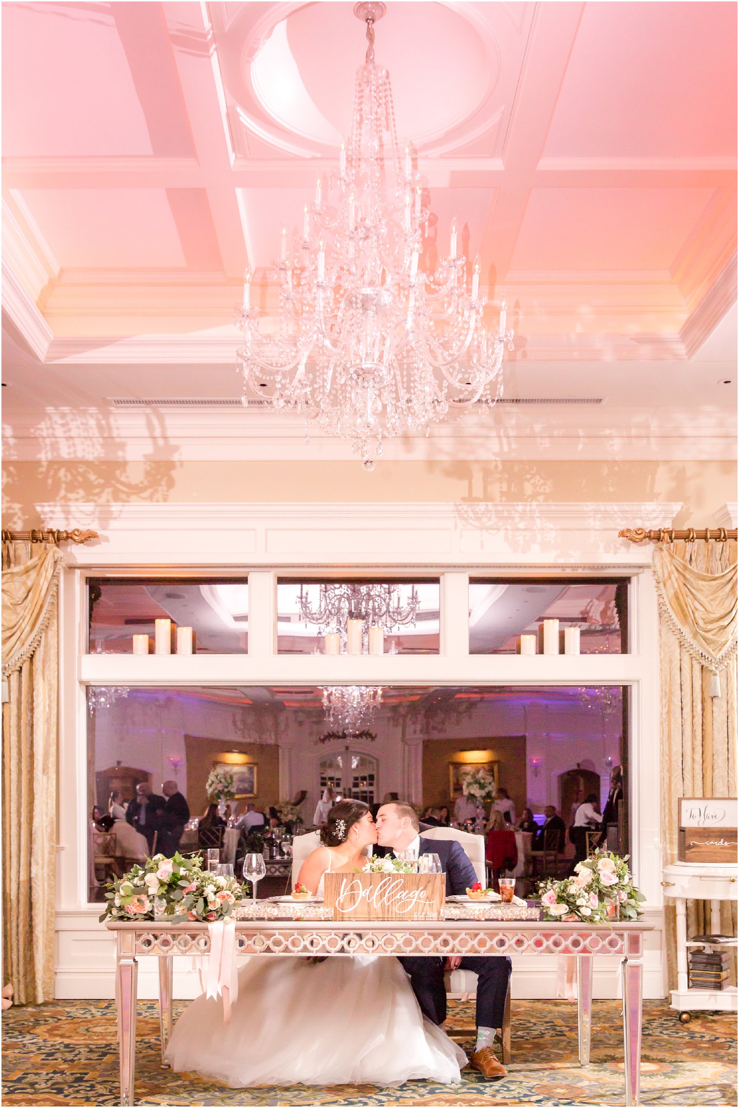 bride and groom at sweetheart table during wedding reception at Clarks Landing Yacht Club in Point Pleasant NJ