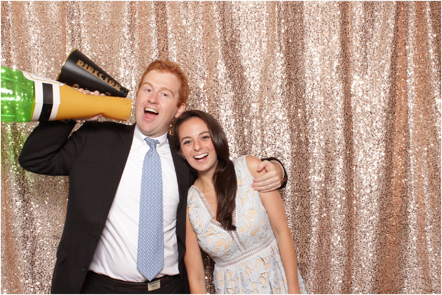 photo booth with champagne sequin backdrop