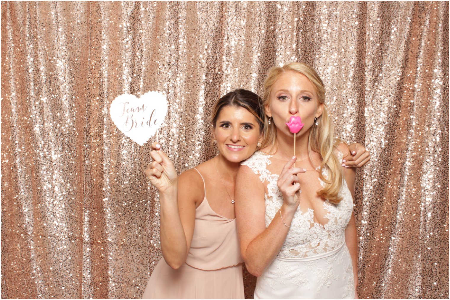 bride and bridesmaid in photo booth