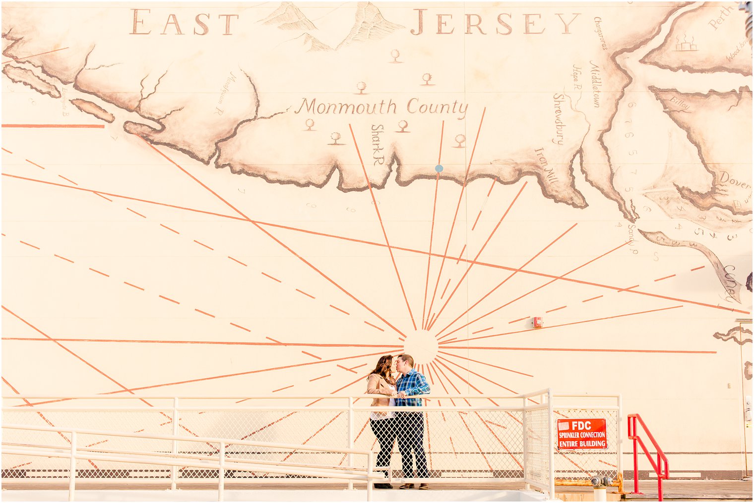 engagement photo with mural in Asbury Park