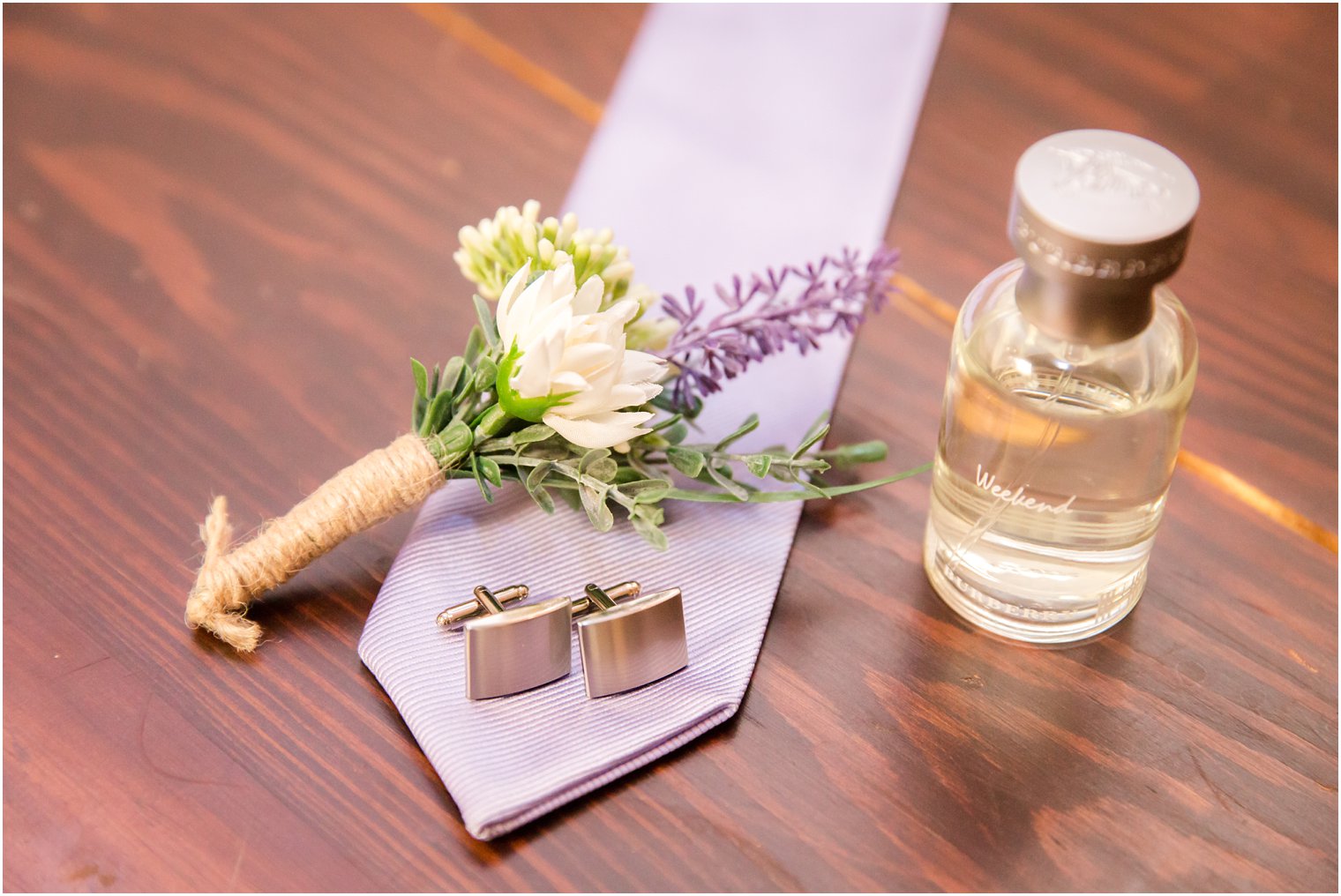 groom details with lavender tie
