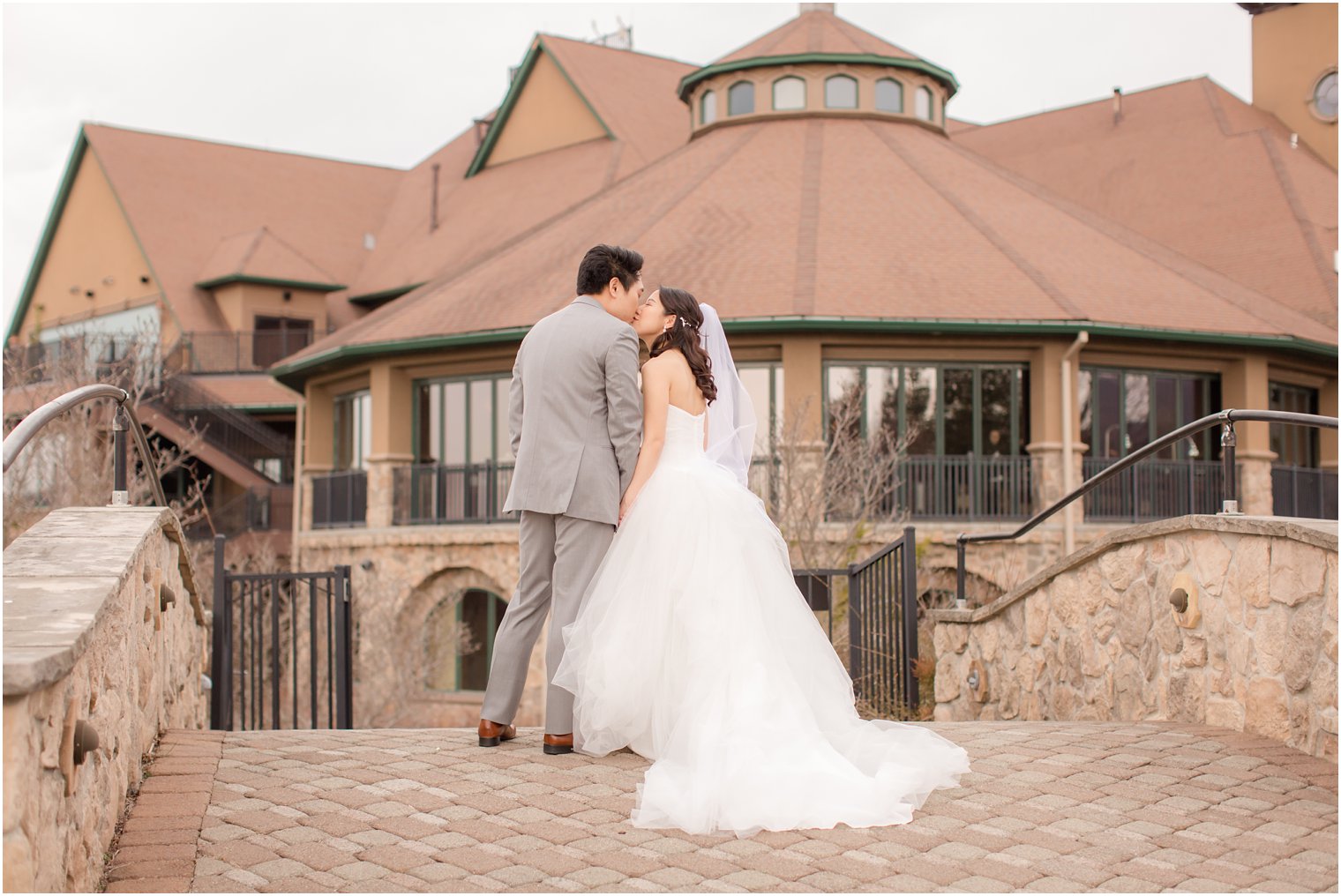 Bride and groom walking towards their wedding venue