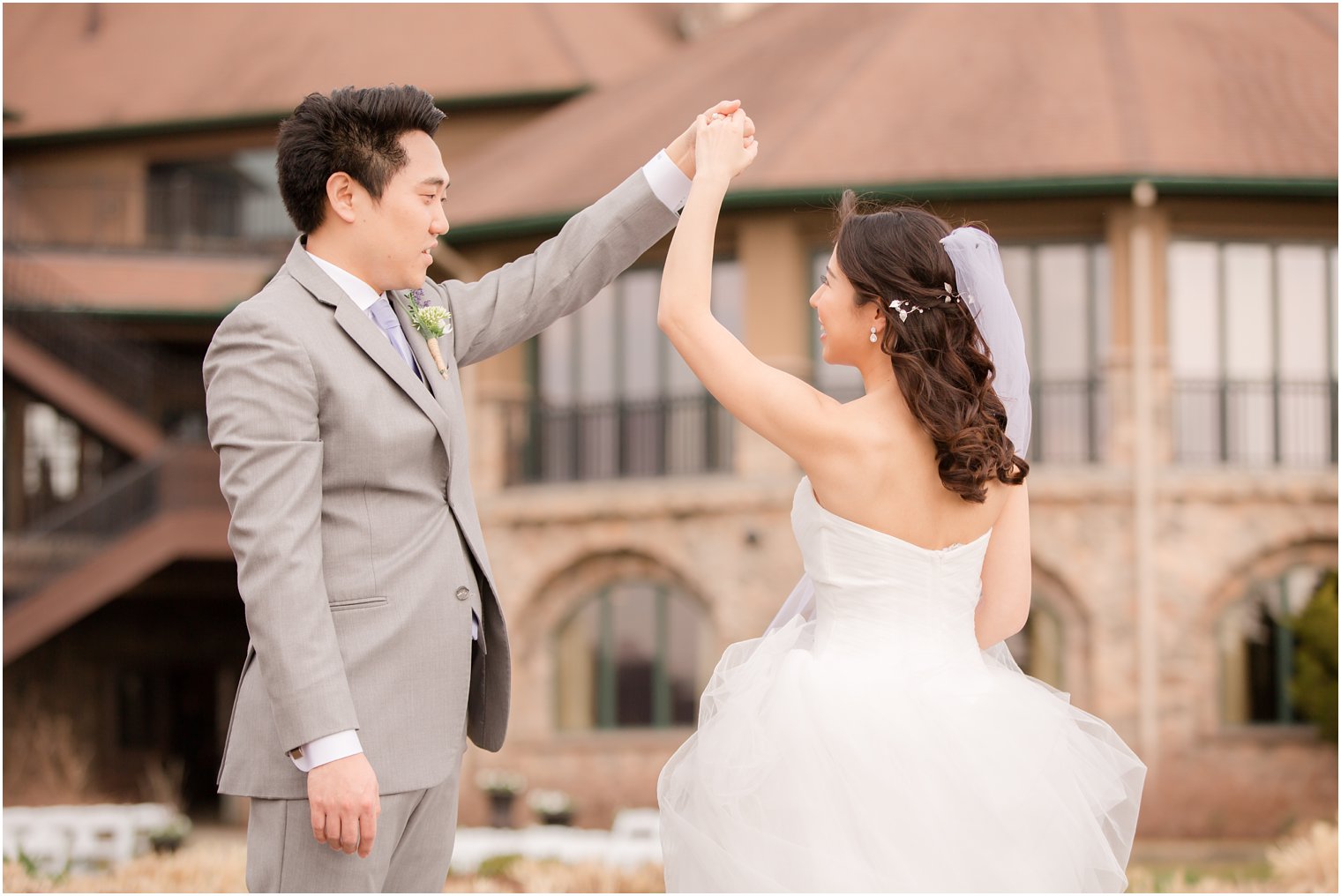 Bride and groom dancing during wedding portraits