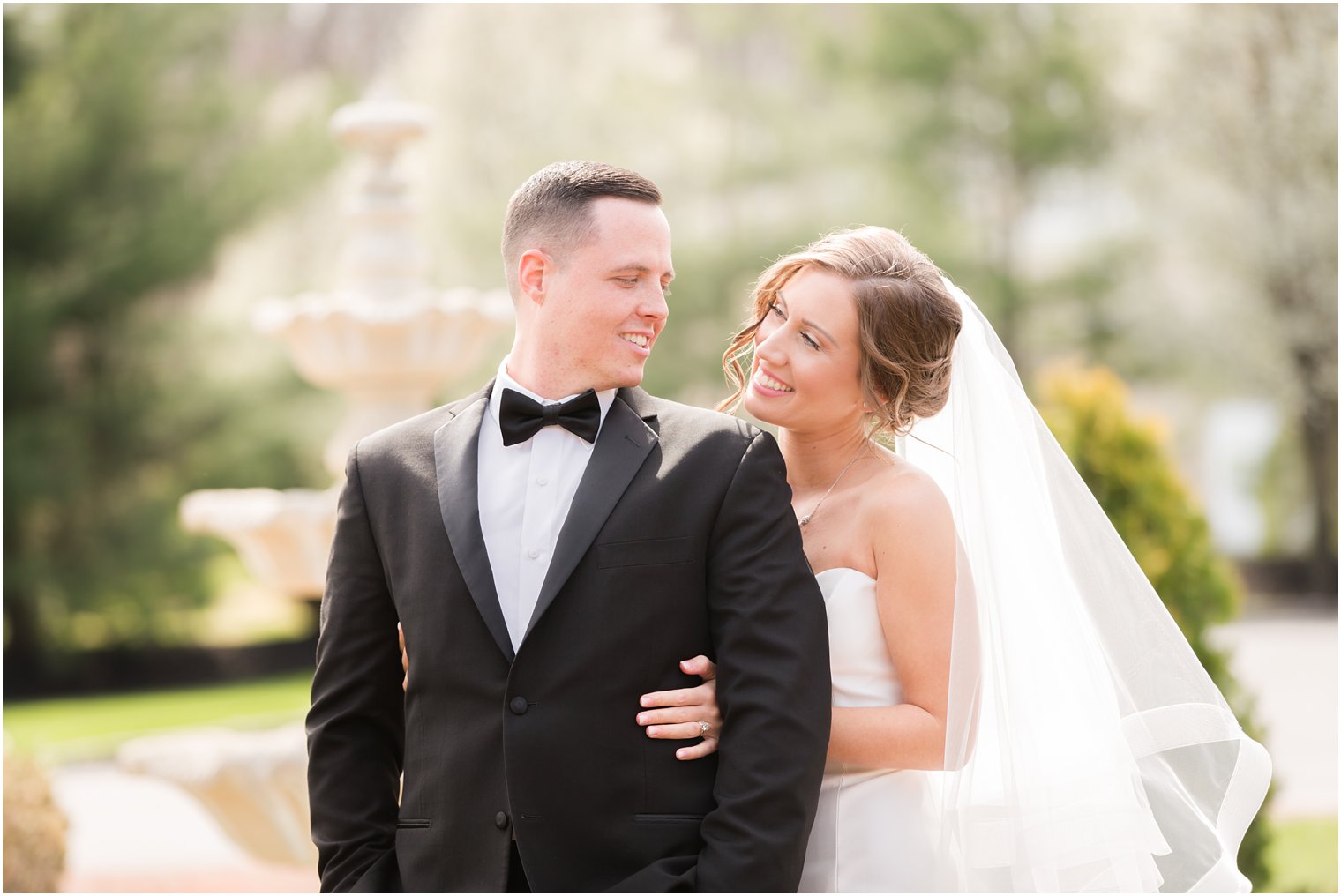 groom wearing black tuxedo