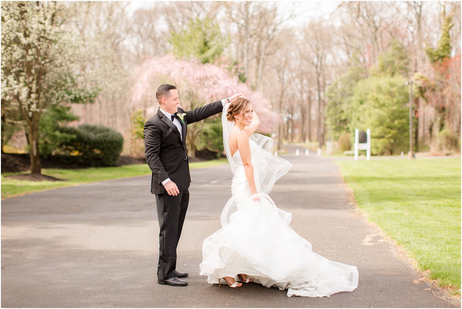 photo of groom twirling bride