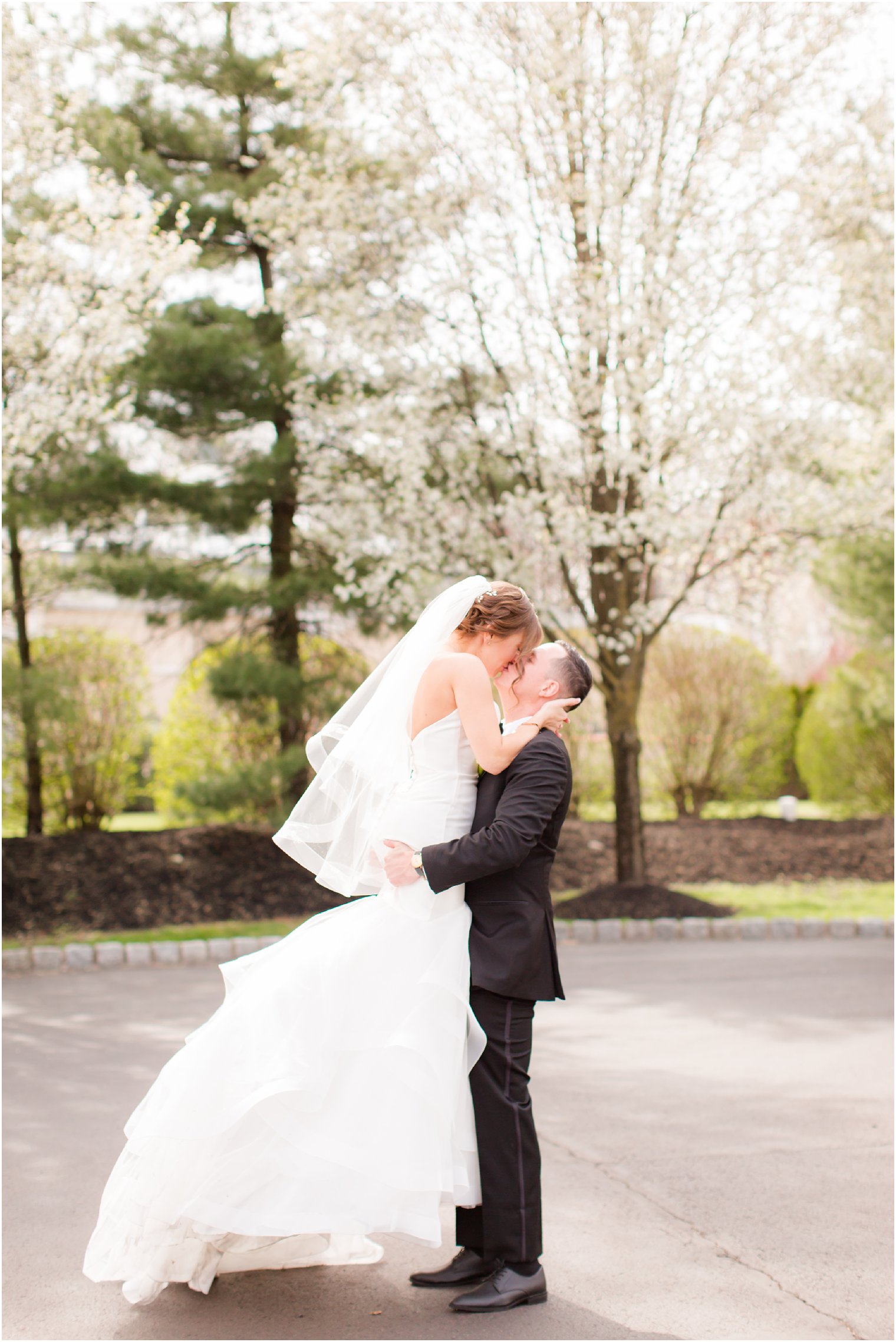 groom picking up his bride