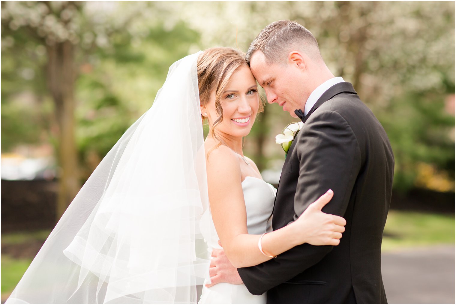 bride and groom photo with dogwoods in the backdrop