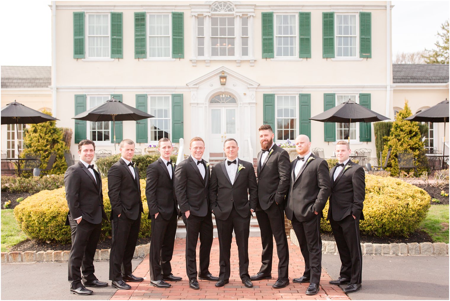 groomsmen in black tuxes