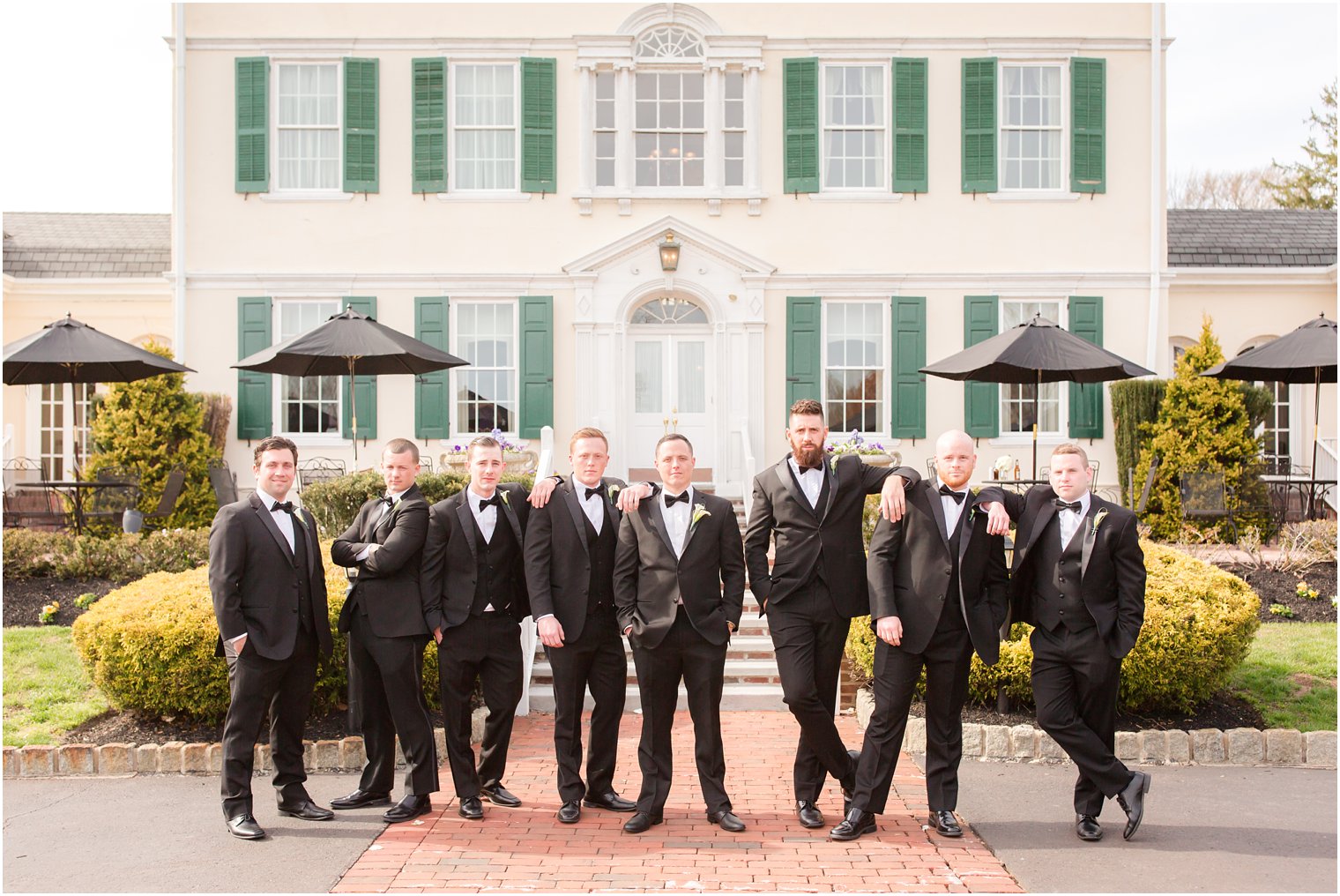 groomsmen wearing black tuxedos