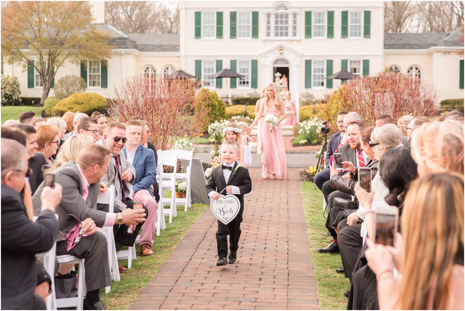 photo of ring bearer at outdoor ceremony at Pen Ryn Estate