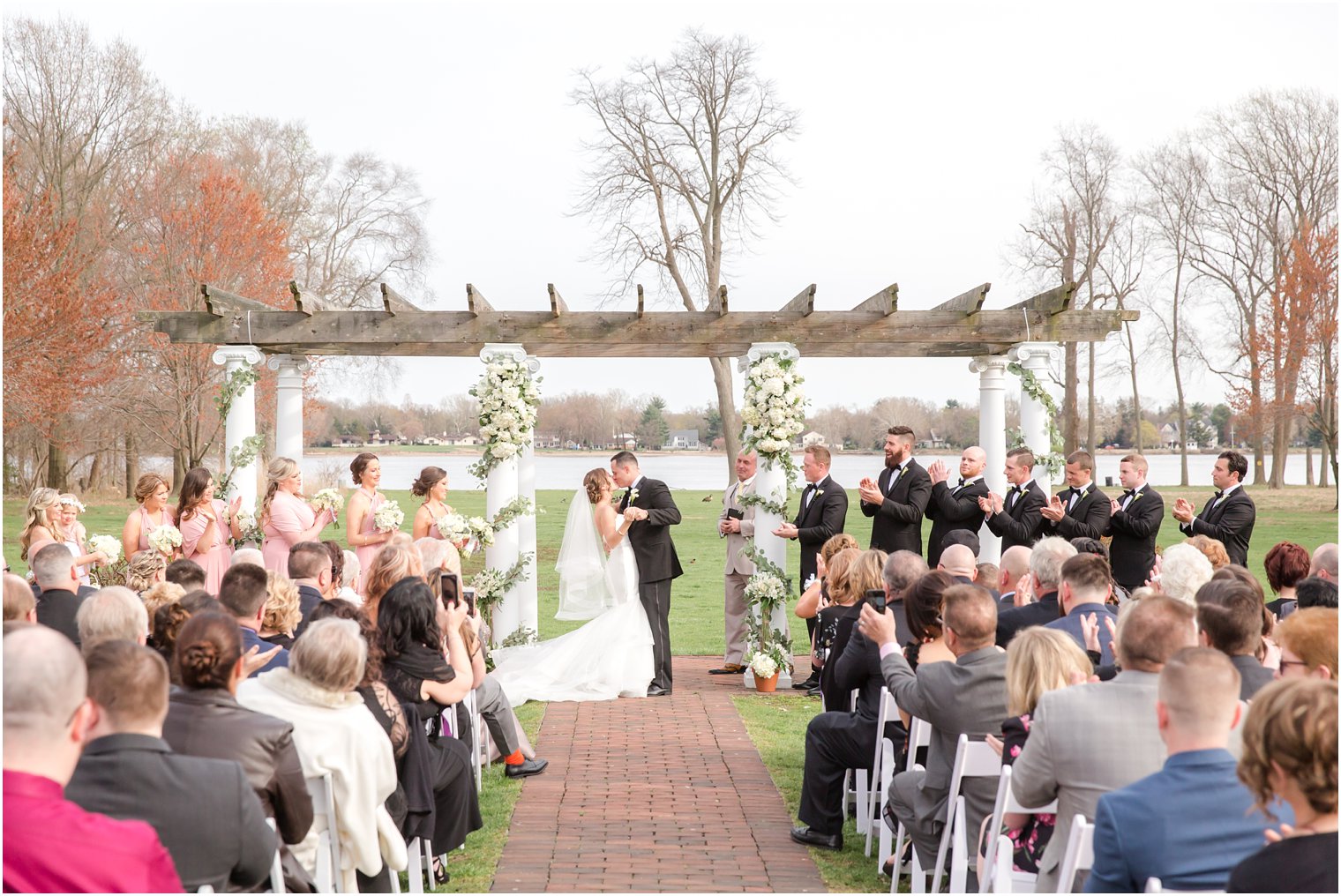 first kiss photo at outdoor ceremony at Pen Ryn Mansion