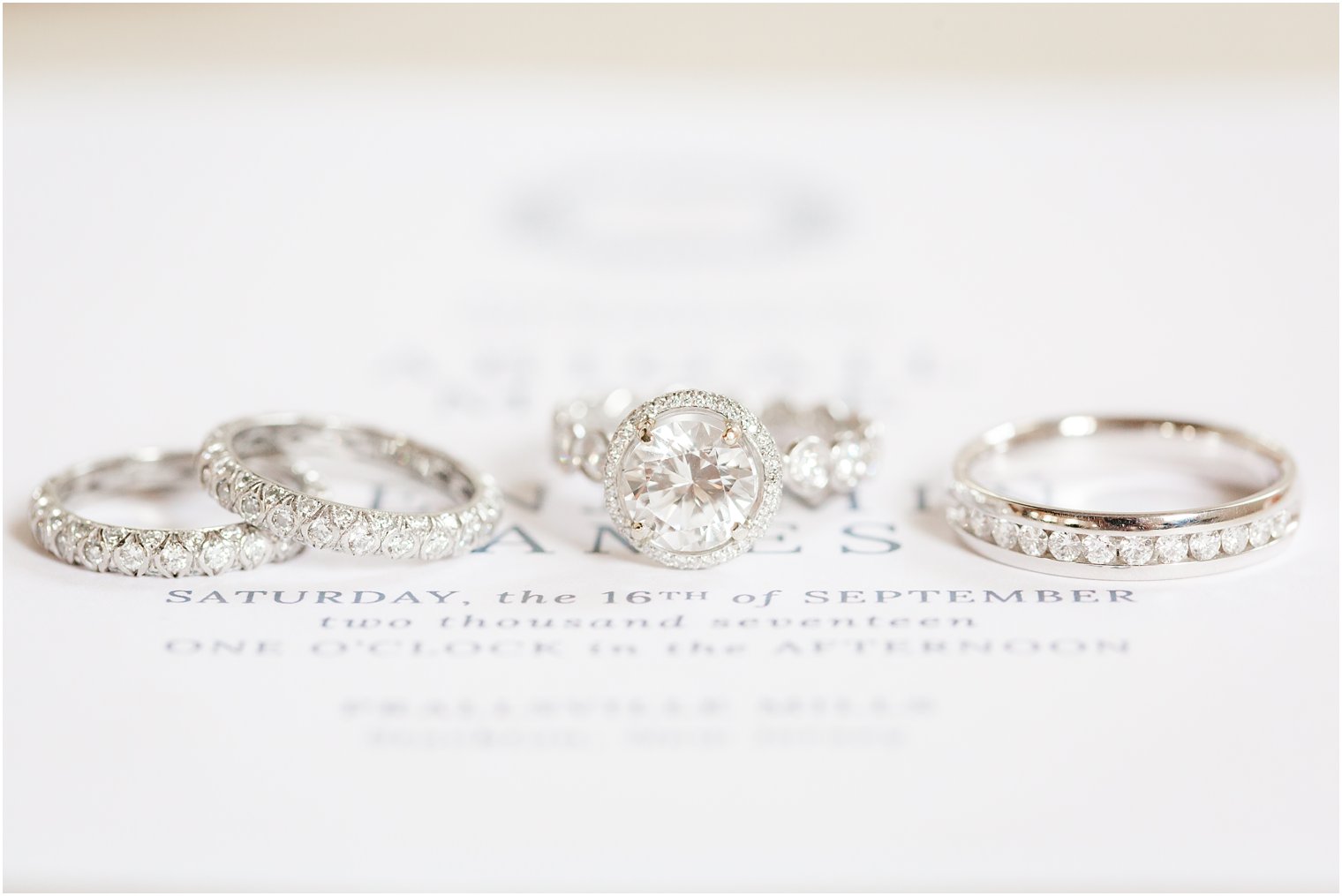 diamond wedding bands on invitation suite photographed by Idalia Photography