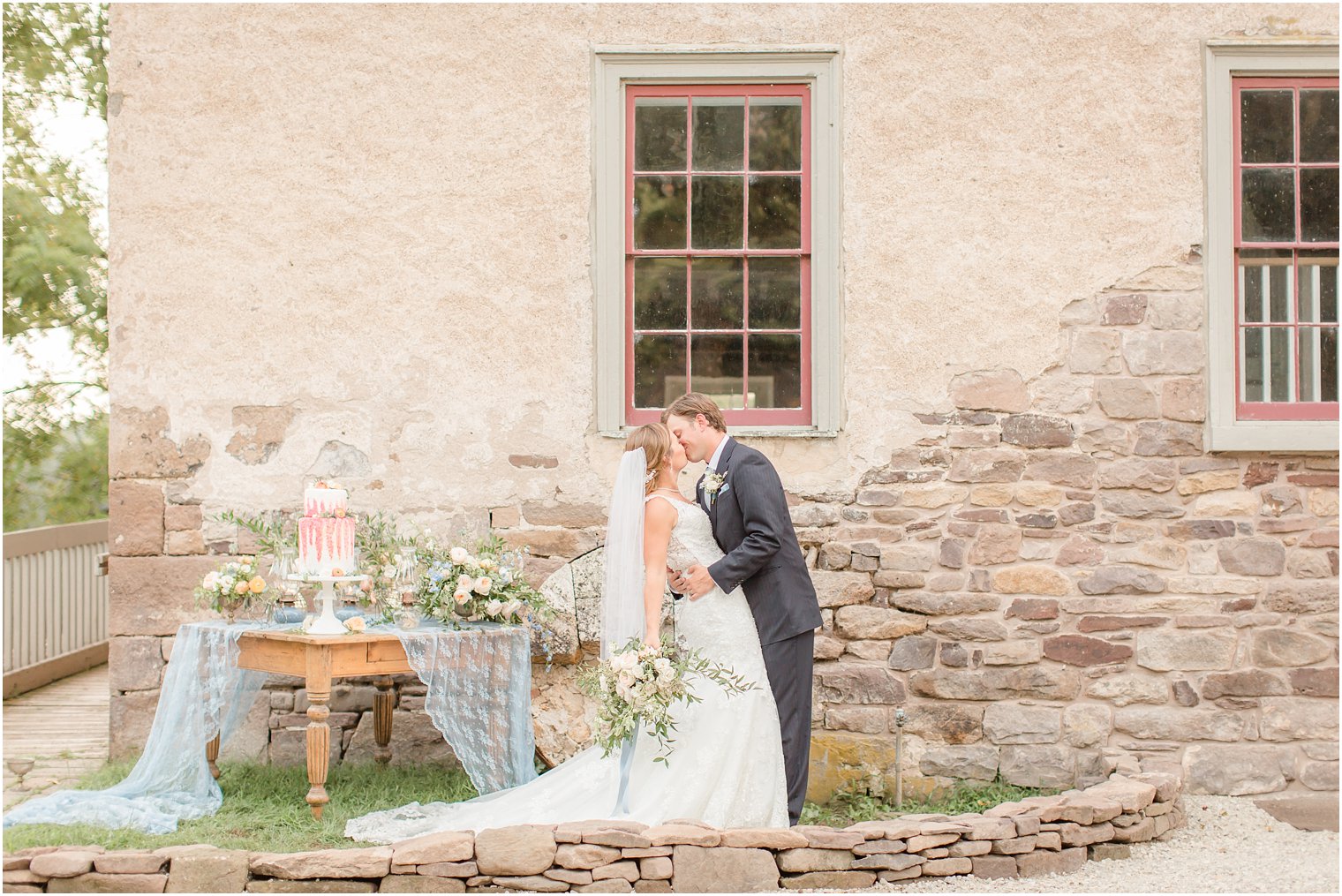 model bride and groom kiss during Prallsville Mills Wedding Editorial shoot with Idalia Photography