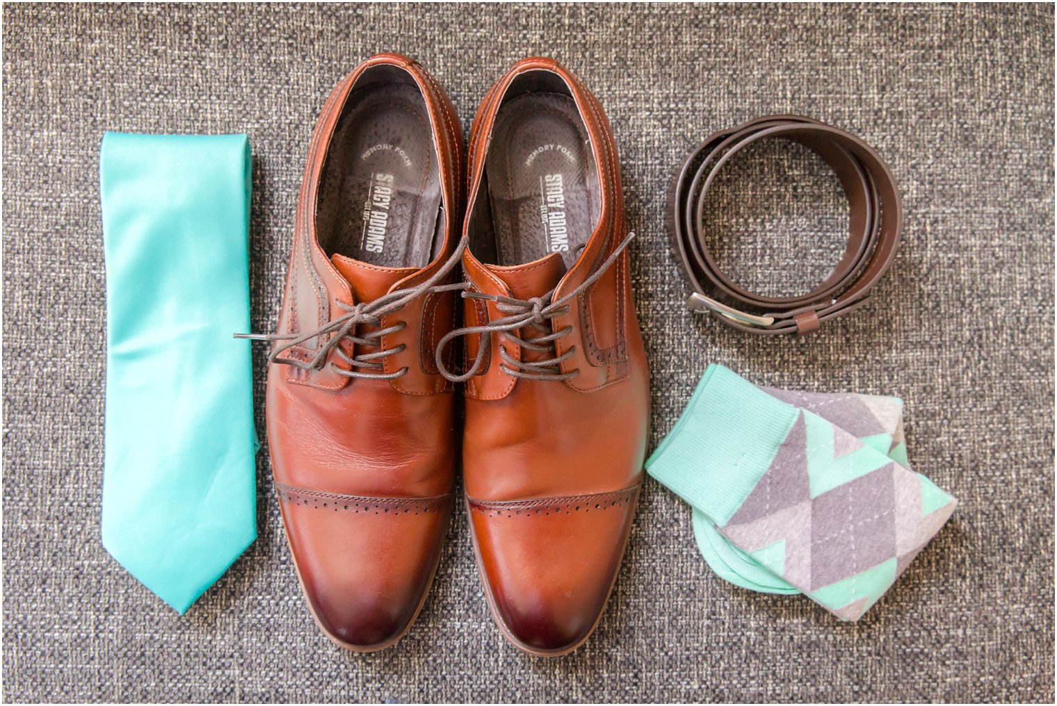 turquoise groomsman tie and socks with brown shoes on wedding day