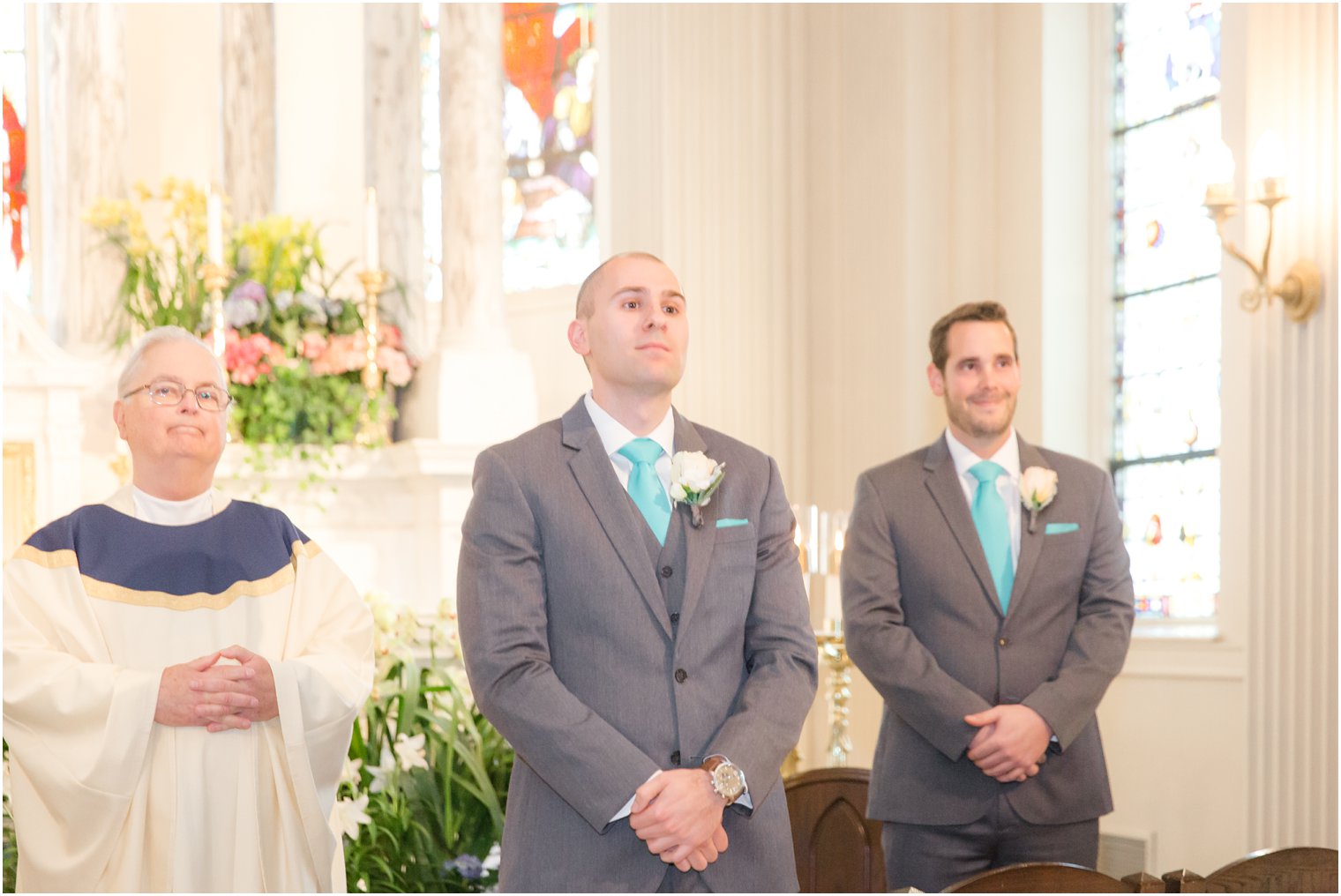 Groom seeing his bride for the first time at St. Catharine's Church in Spring Lake