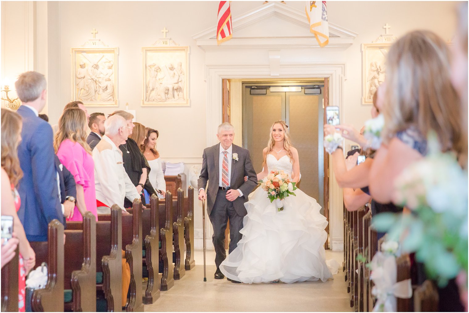 Bride walking down the aisle at St. Catharine's Church in Spring Lake, NJ