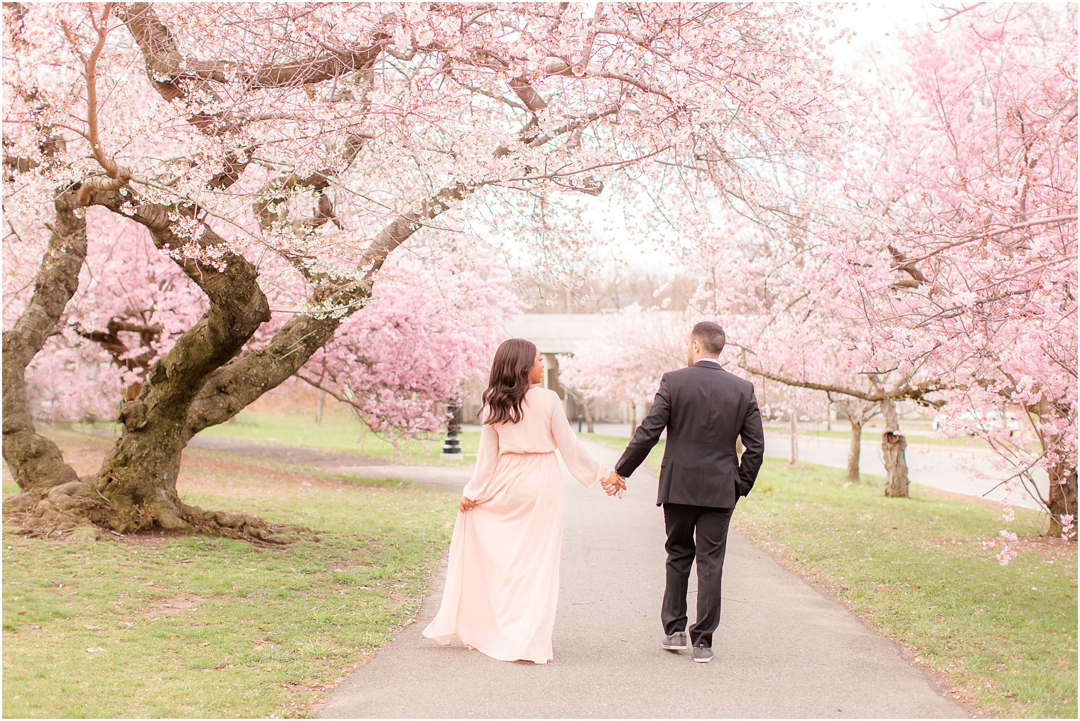 photo of engaged couple walking away