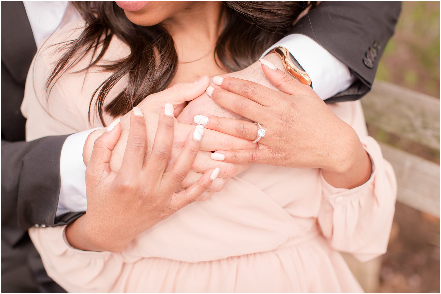 close-up of hands and ring during engagement photos