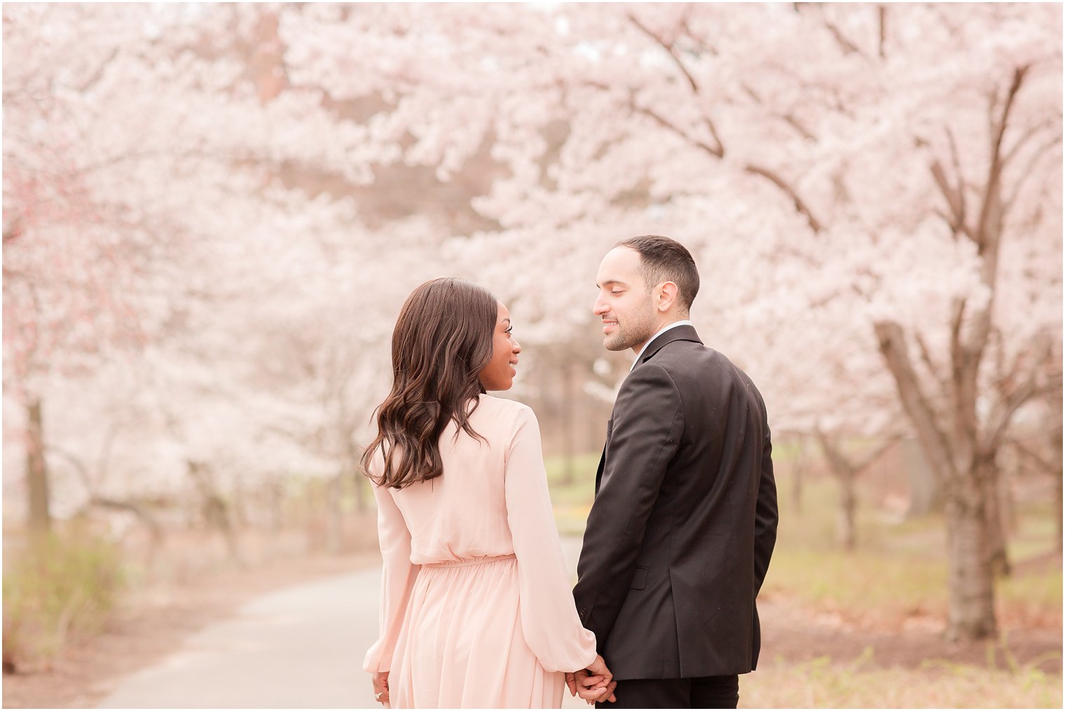 engagement photos in the cherry blossoms