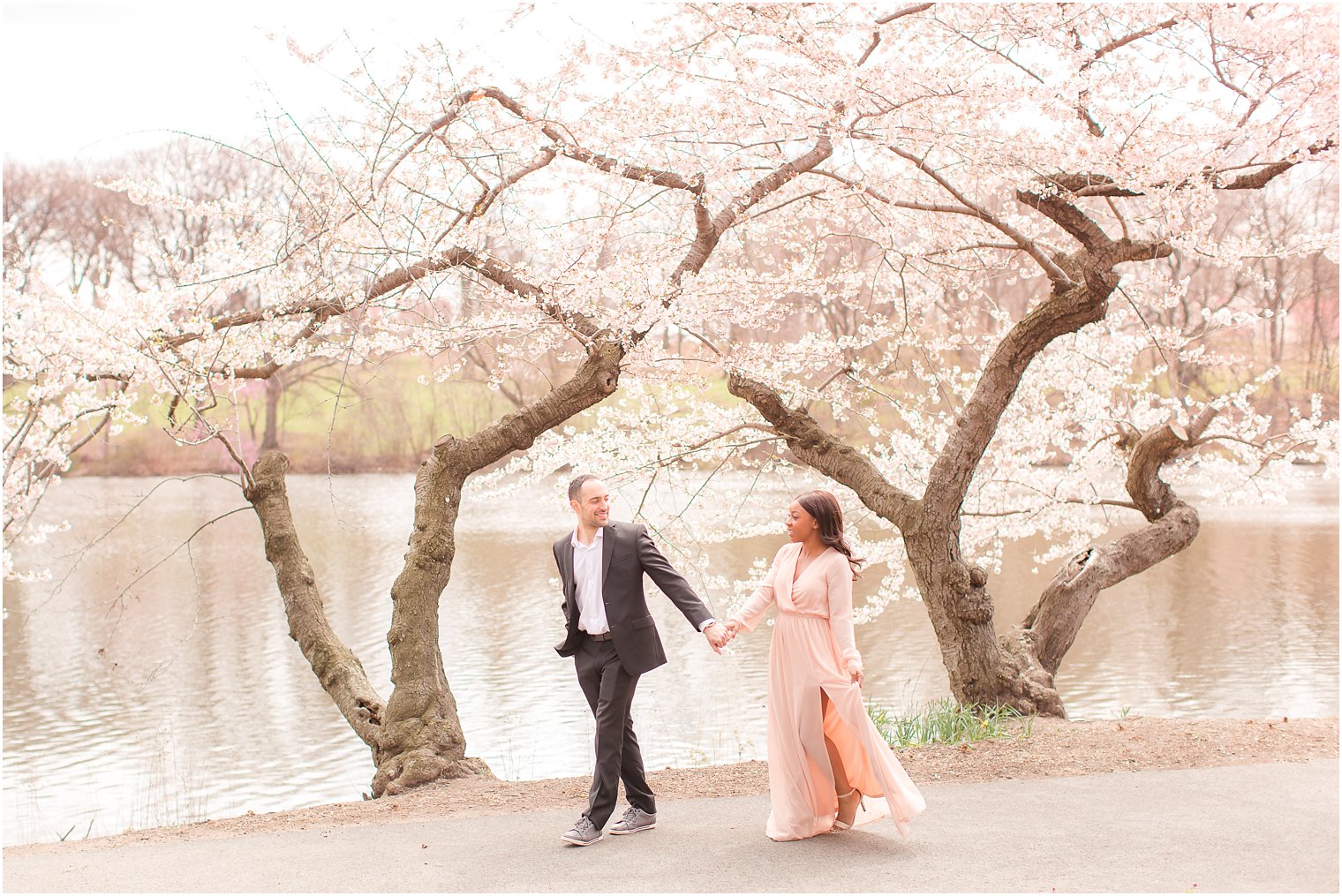 walking photo of bride and groom at Branch Brook Park