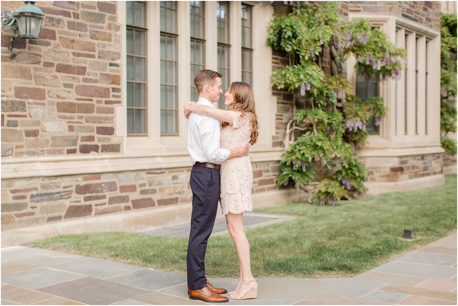 romantic engagement photo with purple flowers