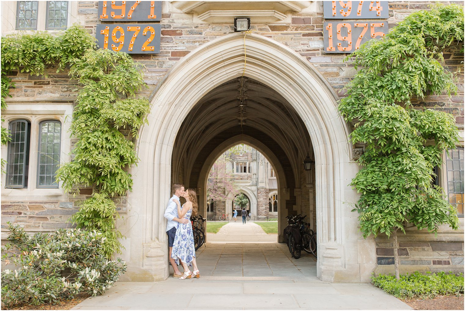 engaged couple under arch at Princeton University