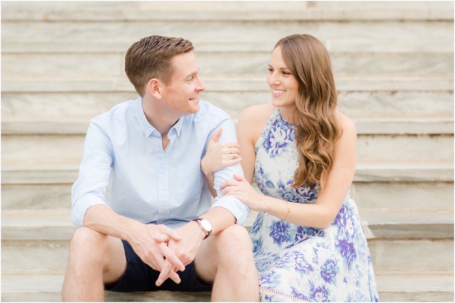 candid photo between engaged couple