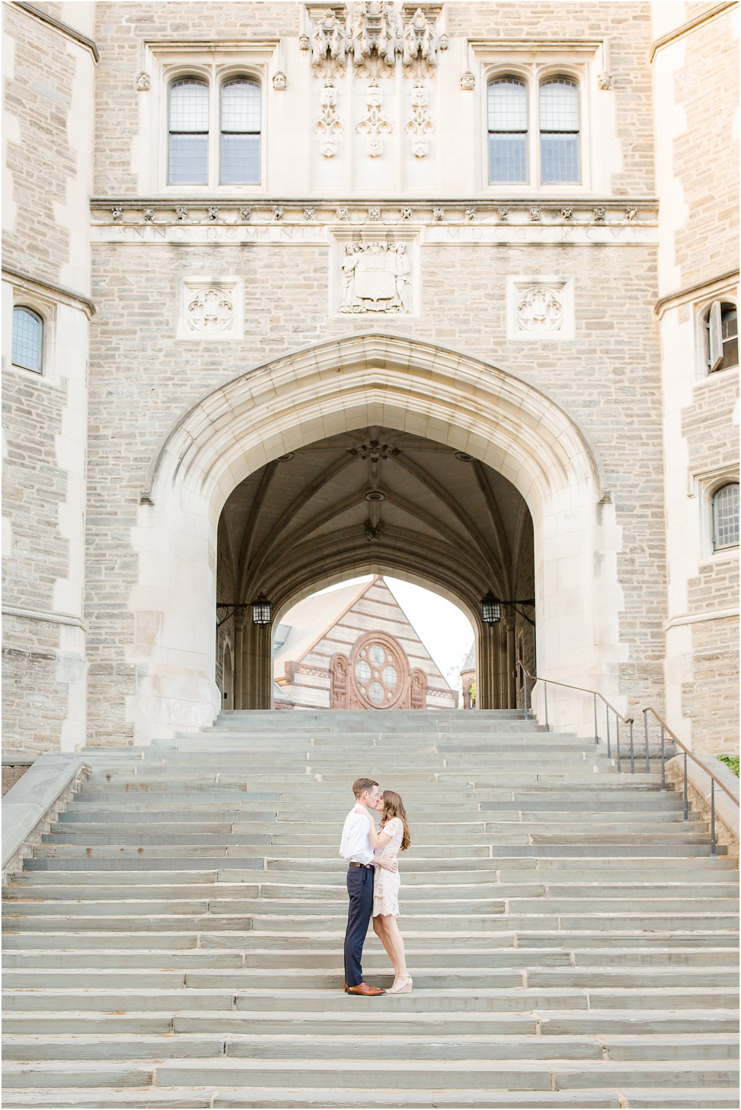 couple kissing in front of classic Princeton University building