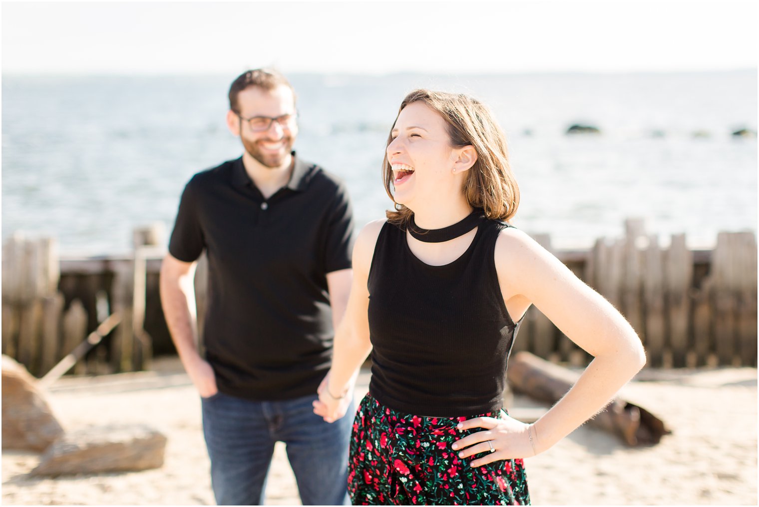 Engaged couple laughing during Sandy Hook Engagement Session