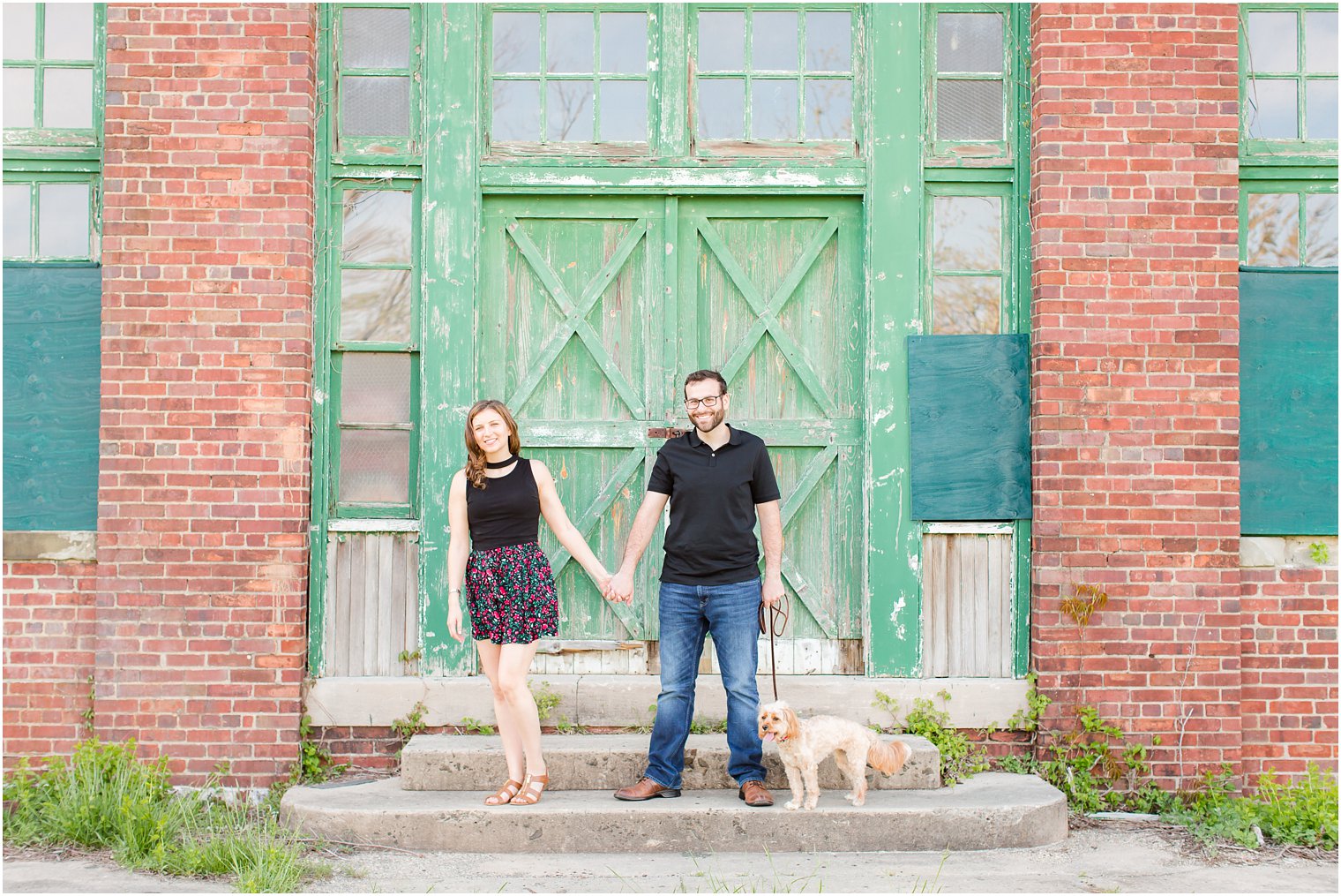 engagement photo of couple with dog