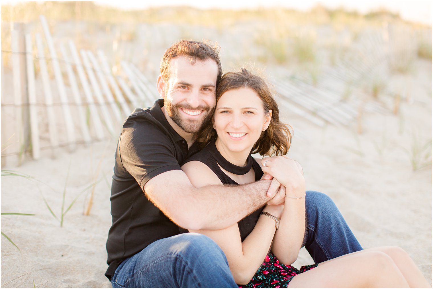 engaged couple on the dunes