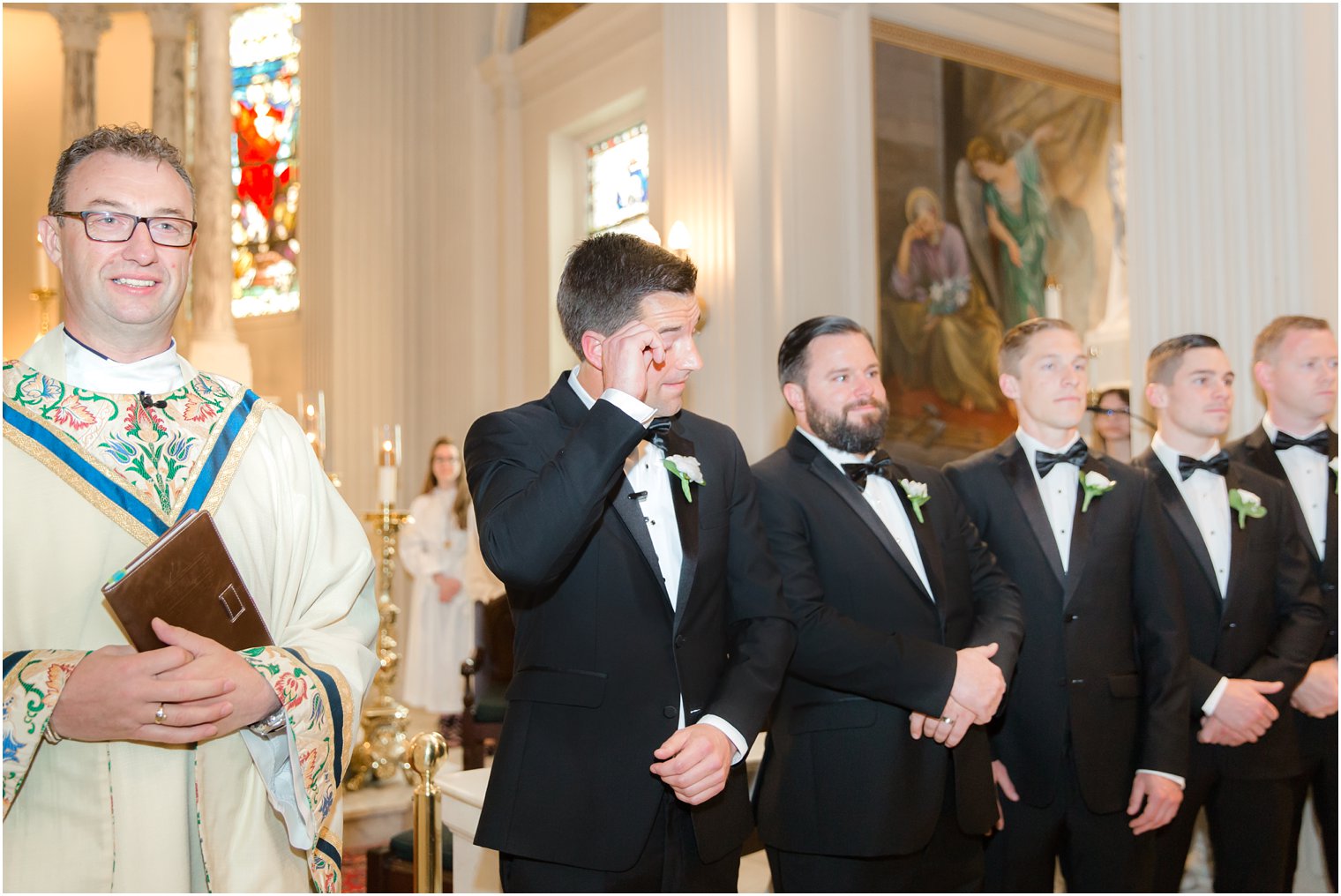 crying groom at the altar