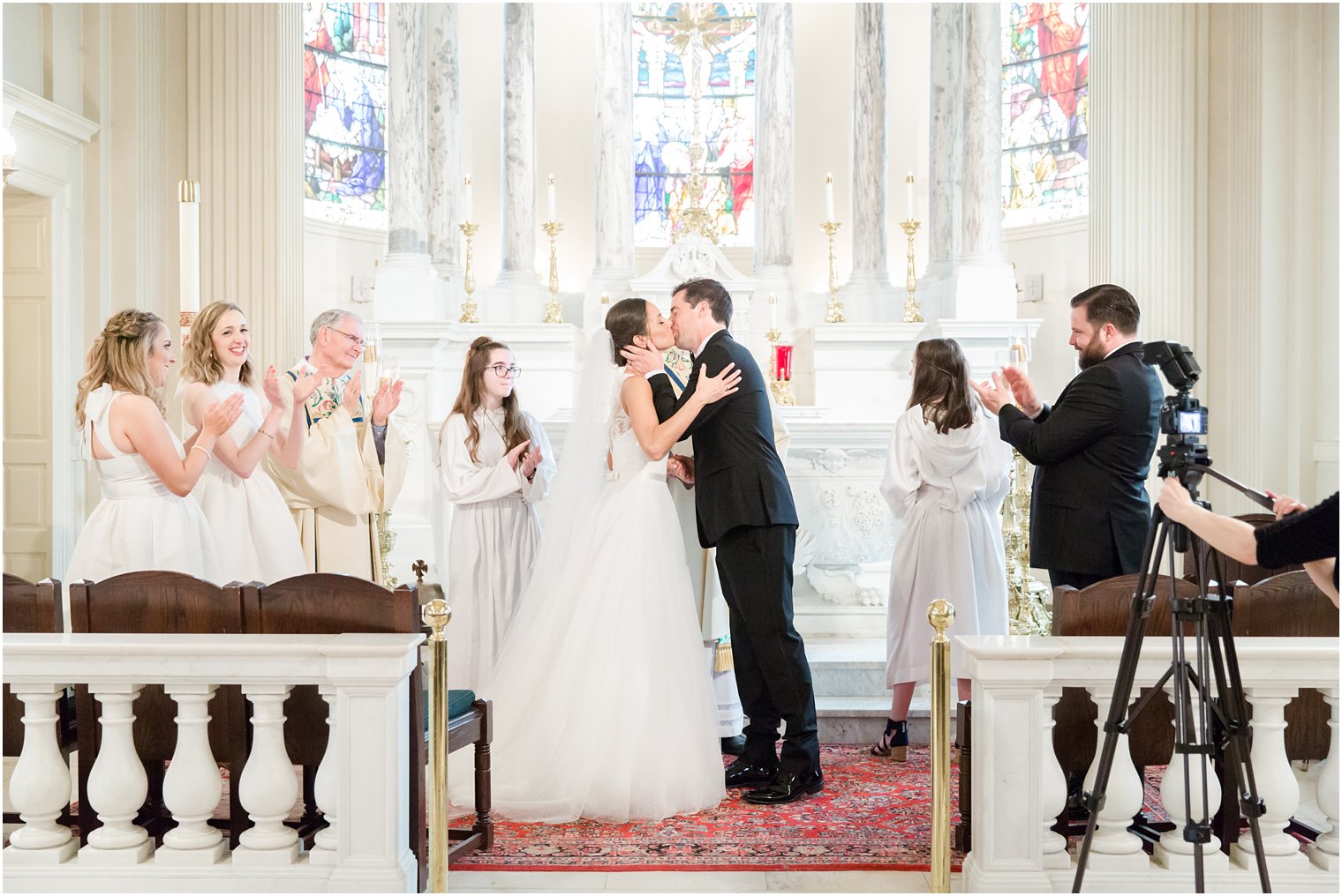 Kiss photo during wedding ceremony at St. Catharine's Church