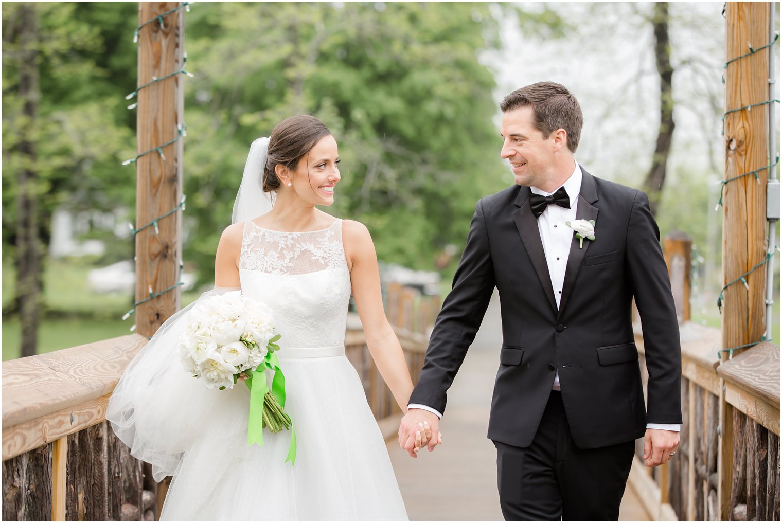 bride and groom walking; candid photo of bride and groom