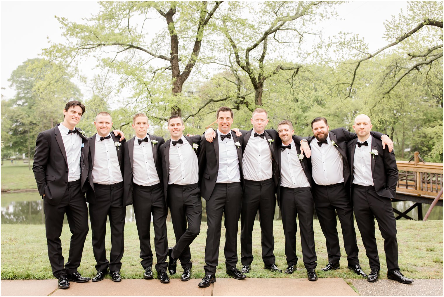 groomsmen in classic black tuxedos