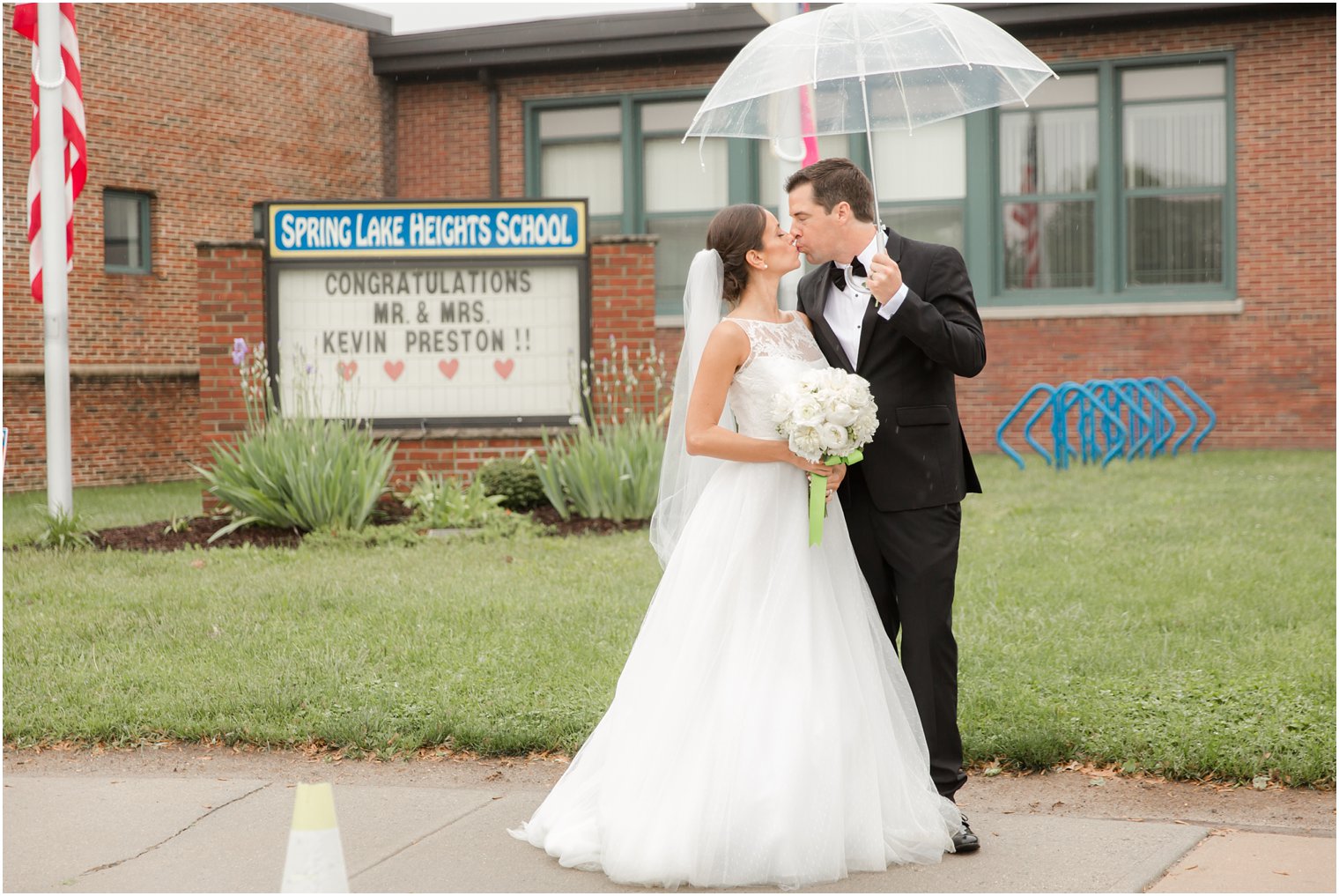 wedding photo in front of a school