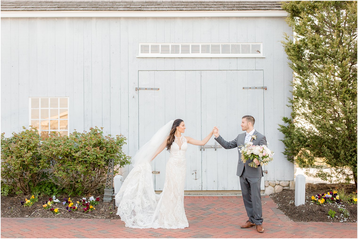 Groom twirling his bride at Bonnet Island Estate