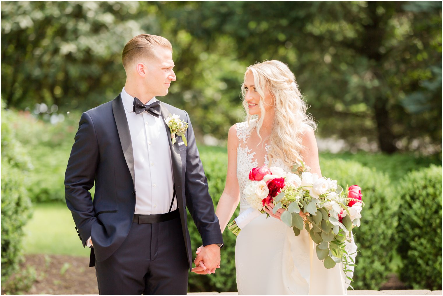 Bride carrying bouquet by Beethoven's Veranda