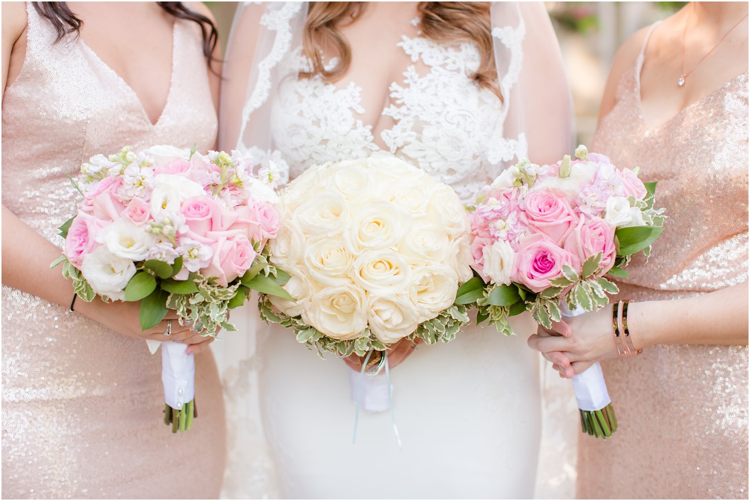 soft pink bouquets with bridesmaids in rose gold