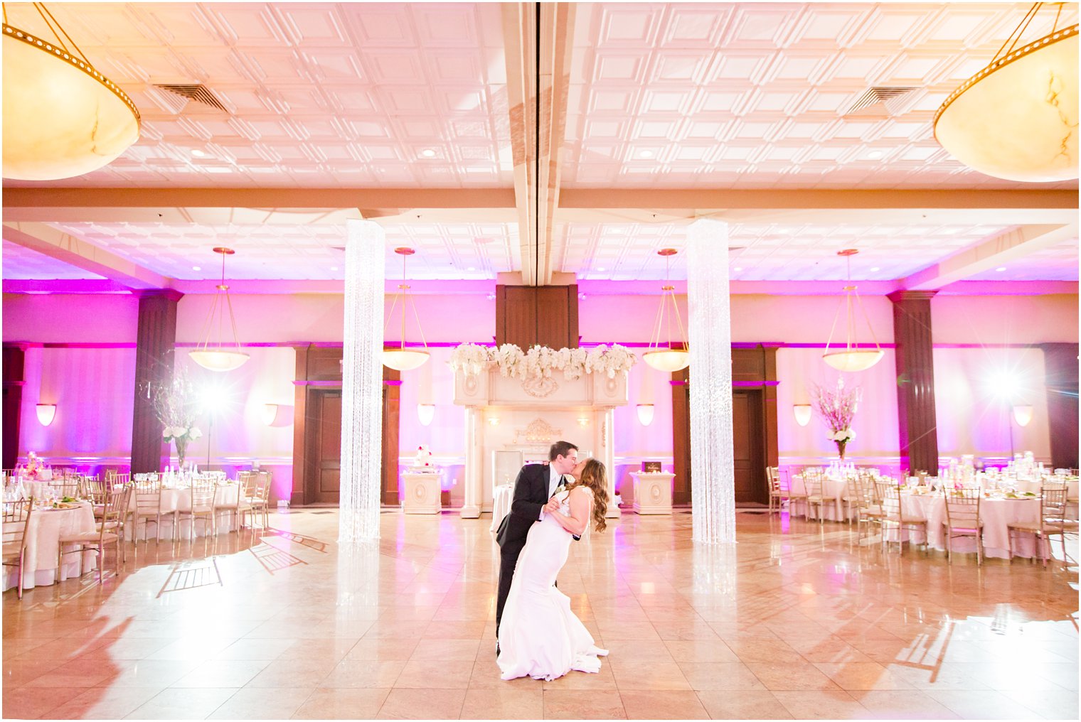 empty ballroom bride and groom dip photo at South Gate Manor